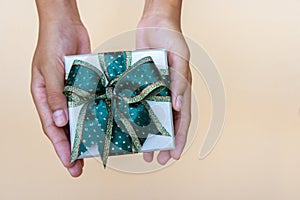 Gift box in hands giving for thankgiving