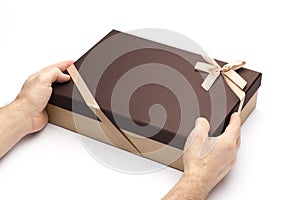 Gift box in hands on a white background.