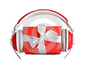 Gift box with headphones on white background