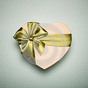 Gift Box Heart With Green Bow On Blue Background.