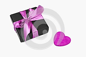 Gift box with a heart. purple heart with a gift box, on a white background. A gift to a loved one