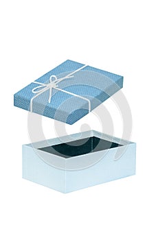 Gift box isolated. Close-up of a blue opened present or gift box with white ribbon bow isolated on a white background. Birthday,