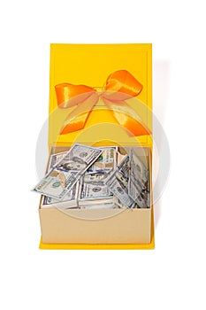 Gift box with a large amount of money in dollars