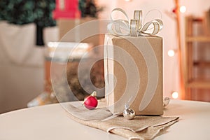 Gift box made of recycled paper on table, happy holiday concept