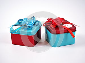 Gift box metal red and blue with ribbon isolated on white background