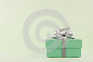 Gift Box, Pastel Green gift box with Silver ribbon and bow on light green background