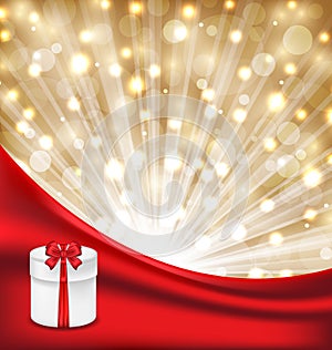 Gift box with red bow on glowing background