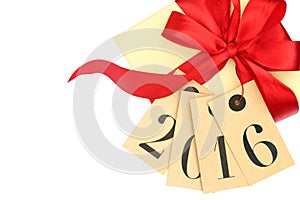 Gift box with red bow and tags with new year 2016