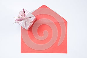Gift box and red envelope on white background