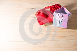 Gift box and Red Gift Bag wrapped Christmas and Newyear presents with bows and ribbons, Christmas frame boxing day background.