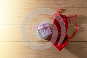 Gift box and Red Gift Bag wrapped Christmas and Newyear presents with bows and ribbons, Christmas frame boxing day background.