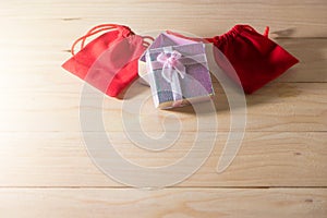 Gift box and Red Gift Bag wrapped Christmas and Newyear presents with bows and ribbons, Christmas frame boxing day background.