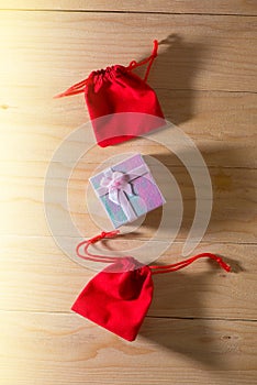 Gift box and Red Gift Bag wrapped Christmas and Newyear presents with bows and ribbons, Christmas frame boxing day background.