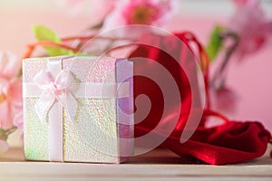 Gift box and Red Gift Bag wrapped and plum blossom Christmas and Newyear presents with bows and ribbons, Christmas frame boxing.