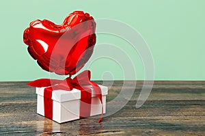 Gift box red heart balloon ribbon bow