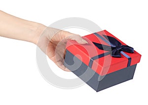 Gift box with a red lid and a blue bow in hand