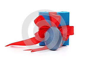 Gift box with red ribbon and Easter egg