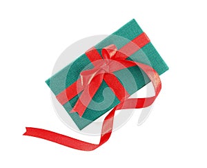 small green gift box with long red ribbon bow isolated on white background