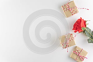 Gift box and red rose flower isolated on white wooden texture background, Happy valentine`s day. holiday background