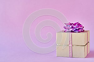 Gift box with ribbon and bow on color background and space for text photo