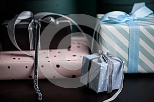 Gift box with ribbon on dark backdround