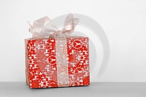 Gift box with ribbon on white background