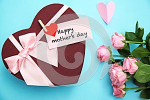 Gift box, roses and greeting card with text