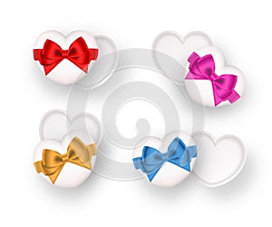 Gift box. Set of cute gifts open white heart shape decorated with red, pink, gold, and blue bow-ribbon isolated on white.