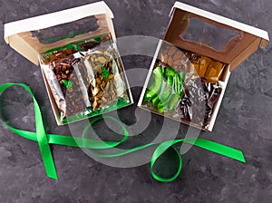 Gift box with set of different dried fruits nuts individually wrapped flat lay. Healthy food diet. Christmas celebration