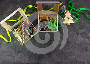 Gift box with set of different dried fruits nuts individually wrapped flat lay. Healthy food diet. Christmas celebration