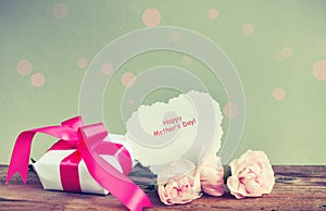 Gift box, three pink carnations, paper note