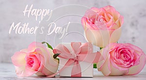 Gift box with tied ribbon bow pink roses. Greeting card. Present for springtime holidays. Text Happy mothers day. poster