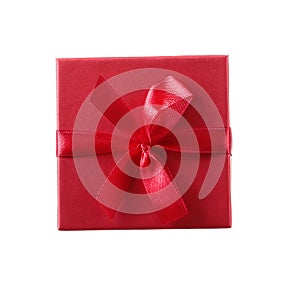 Gift box with white ribbon isolated on red background. Clipp