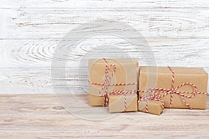 Gift box on the wooden background. Red ribbon. Valentine Day gift