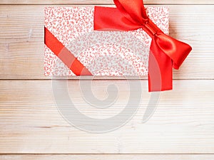 Gift box on the wooden floor