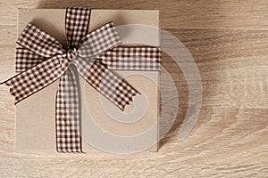 Gift box on wooden table with copy space