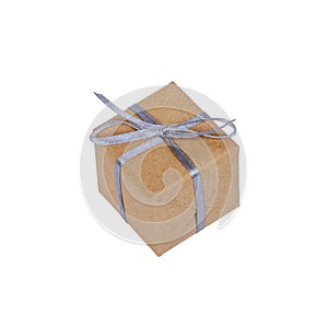 Gift box wrapped in brown recycled paper with silver ribbon top view isolated on white background, clipping path included