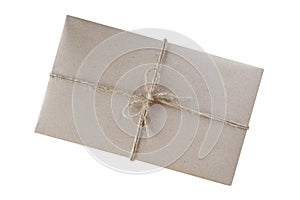 Gift box wrapped in brown recycled paper and tied with rustic bu