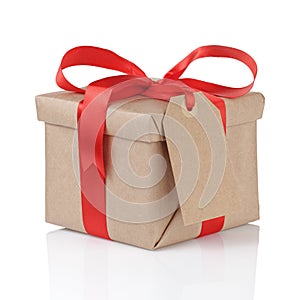 Gift box wrapped with kraft paper and red bow