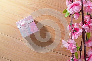 Gift box wrapped and plum blossom Christmas and Newyear presents with bows and ribbons, Christmas frame boxing day background.