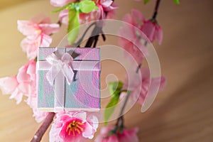 Gift box wrapped and plum blossom Christmas and Newyear presents with bows and ribbons, Christmas frame boxing day background.