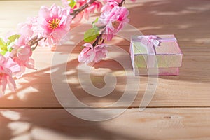 Gift box wrapped and plum blossom Christmas and Newyear presents with bows and ribbons, Christmas frame boxing day background.