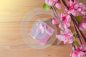 Gift box wrapped and plum blossom Christmas and Newyear presents with bows and ribbons, Christmas frame boxing day background.