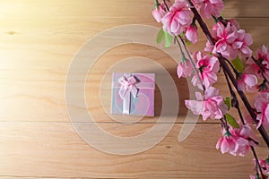 Gift box wrapped and plum blossom Christmas and Newyear presents with bows and ribbons, Christmas frame boxing day background.
