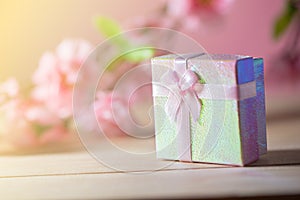 Gift box wrapped and plum blossom Christmas and Newyear presents with bows and ribbons, Christmas frame boxing day background.