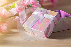 Gift box wrapped and plum blossom Christmas and Newyear presents with bows and ribbons, Christmas frame boxing day background.