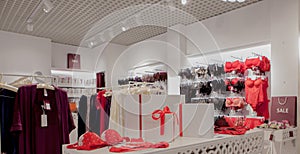 Gift boxes on the background of a lingerie store. Advertising, sales, fashion concept