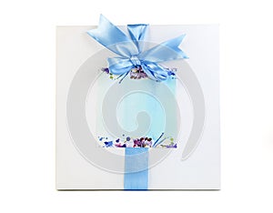 Gift boxes with blue ribbons on a white background