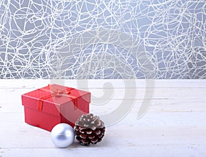 Gift boxes with bow and christmas balls on wood background. Decoration