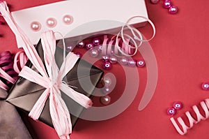 Gift boxes with bow on red background